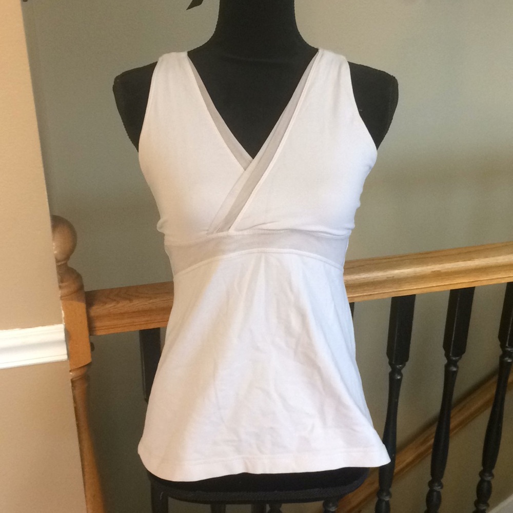 Lululemon workout top with bra, mesh, and pocket